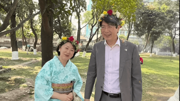 Japanese Ambassador Iwama and his wife wearing flower crowns in Bangladesh